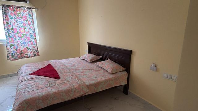 Bedroom with double bed by the window