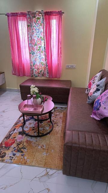 Sofa and coffee table with patterned rug