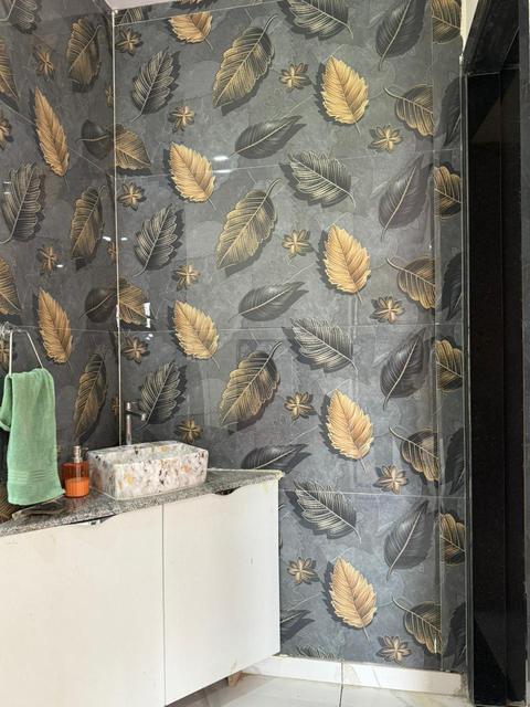 Bathroom vanity with leaf-pattern feature wall