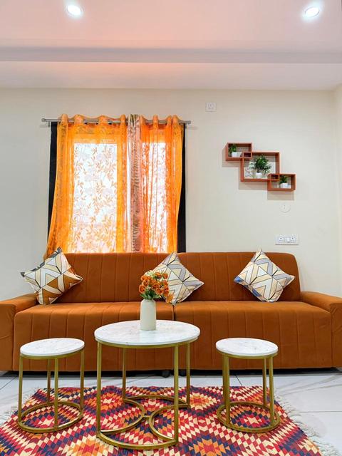 Sofa with side tables and patterned rug