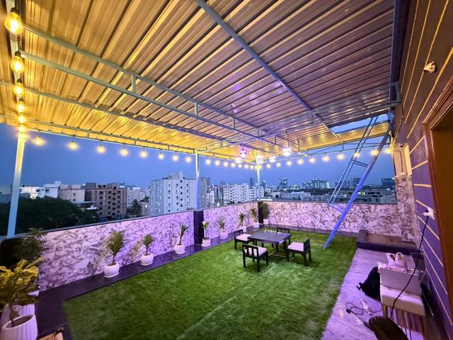 Wide view of the penthouse rooftop terrace and pergola