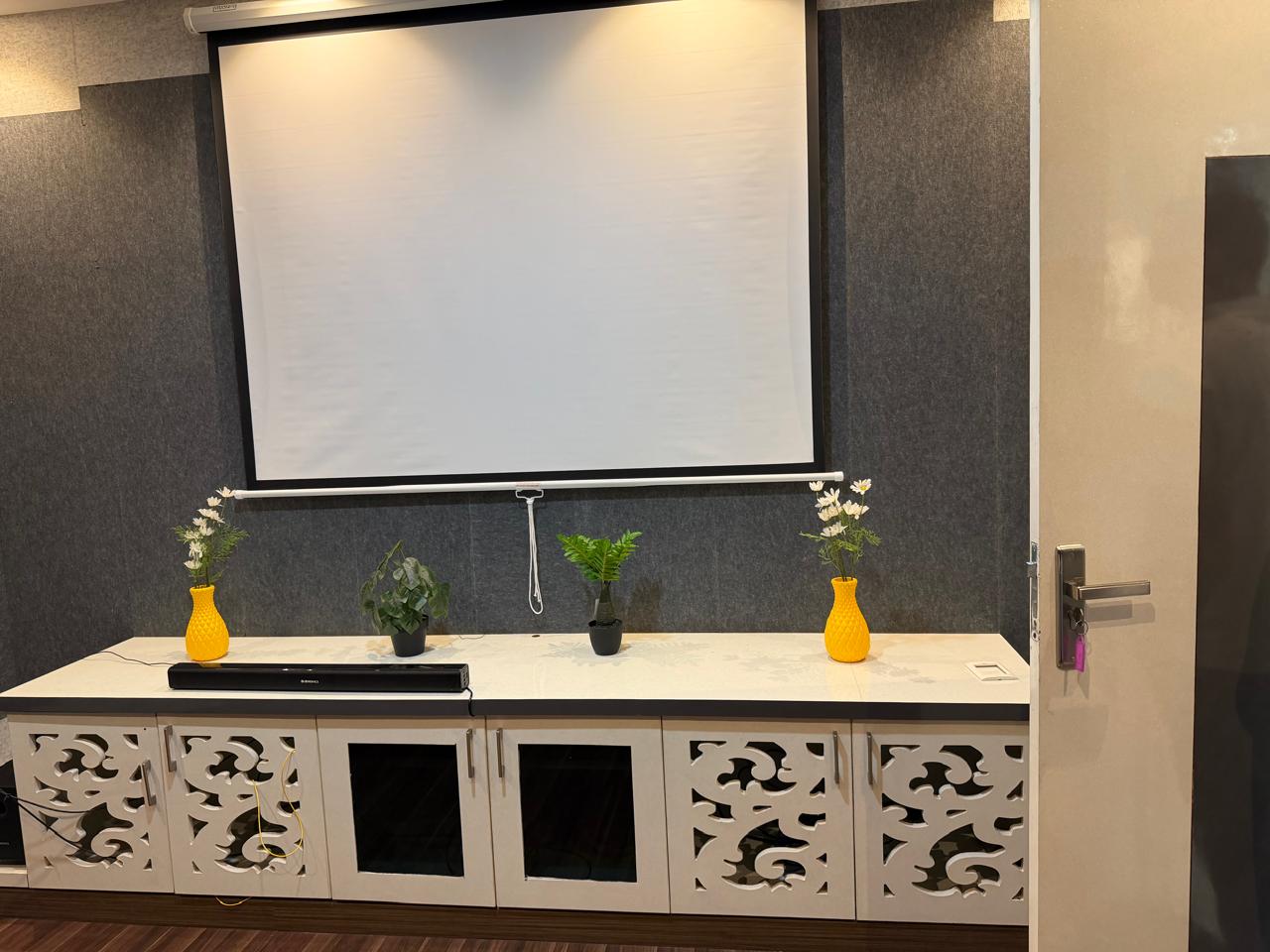 Projector screen with soundbar